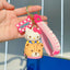 Sanrio on Race Car with Rolling Wheel Keychain - HugmieToys