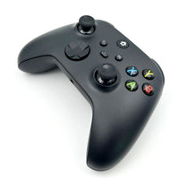 Close-up angled view of the WR007 Xbox Wireless Controller in black, highlighting precision thumbsticks and responsive action buttons.