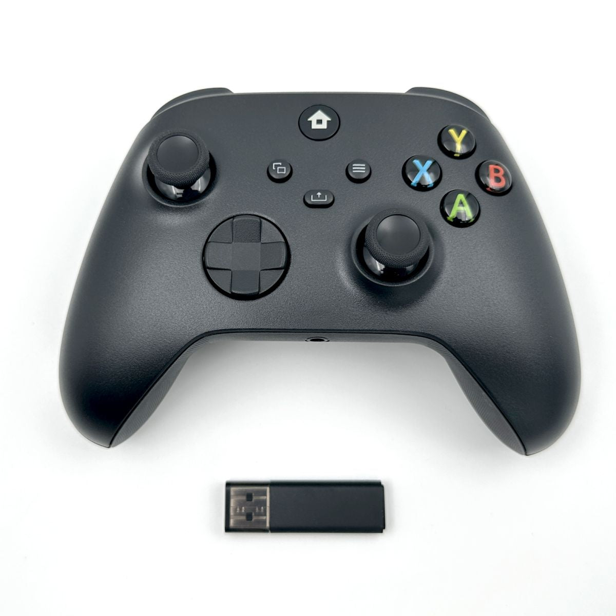 WR007 Xbox Wireless Controller in black with 2.4GHz Bluetooth connectivity and USB dongle. Ergonomic design for immersive gaming experience.