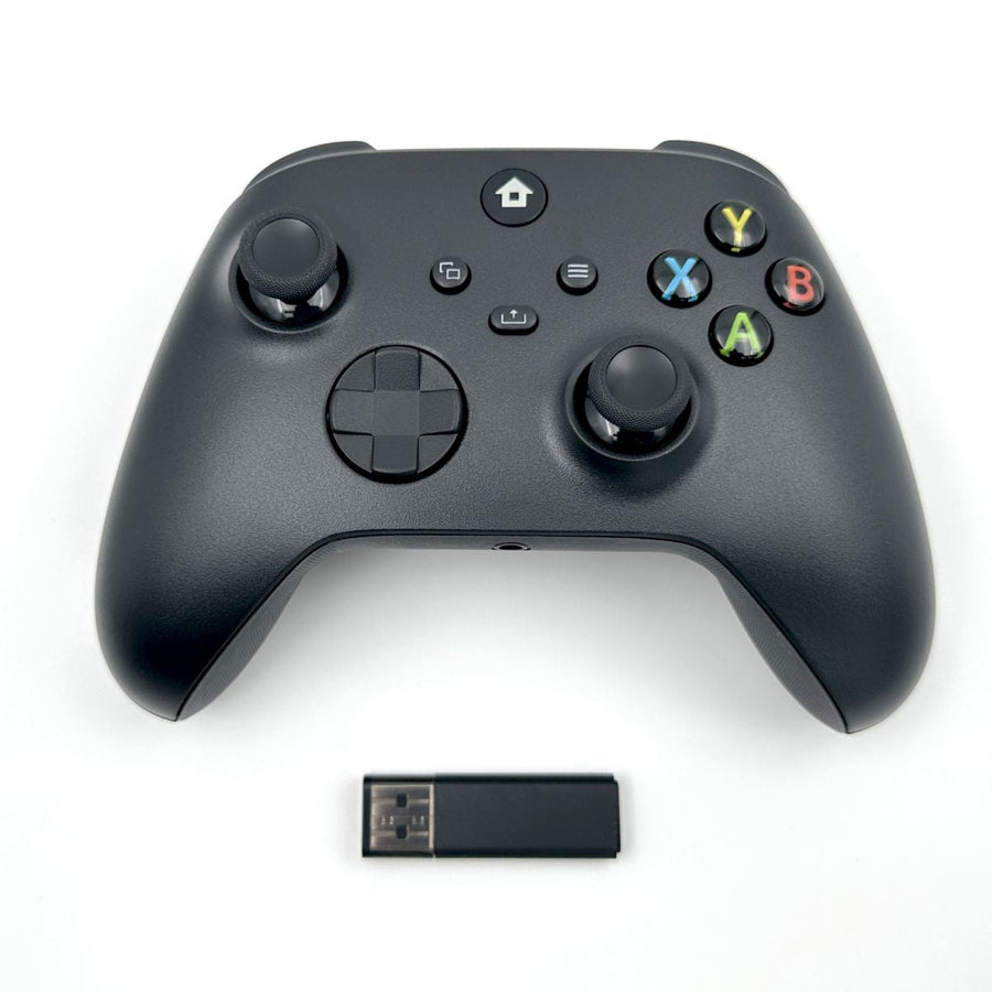 WR007 Xbox Wireless Controller in black with 2.4GHz Bluetooth connectivity and USB dongle. Ergonomic design for immersive gaming experience.